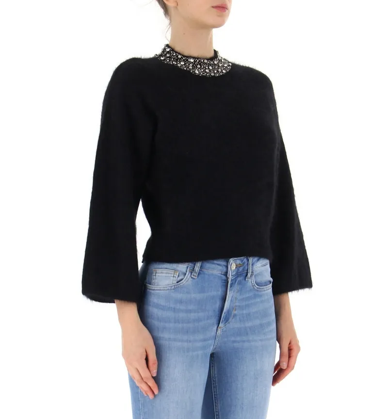 Maglione con applicazioni