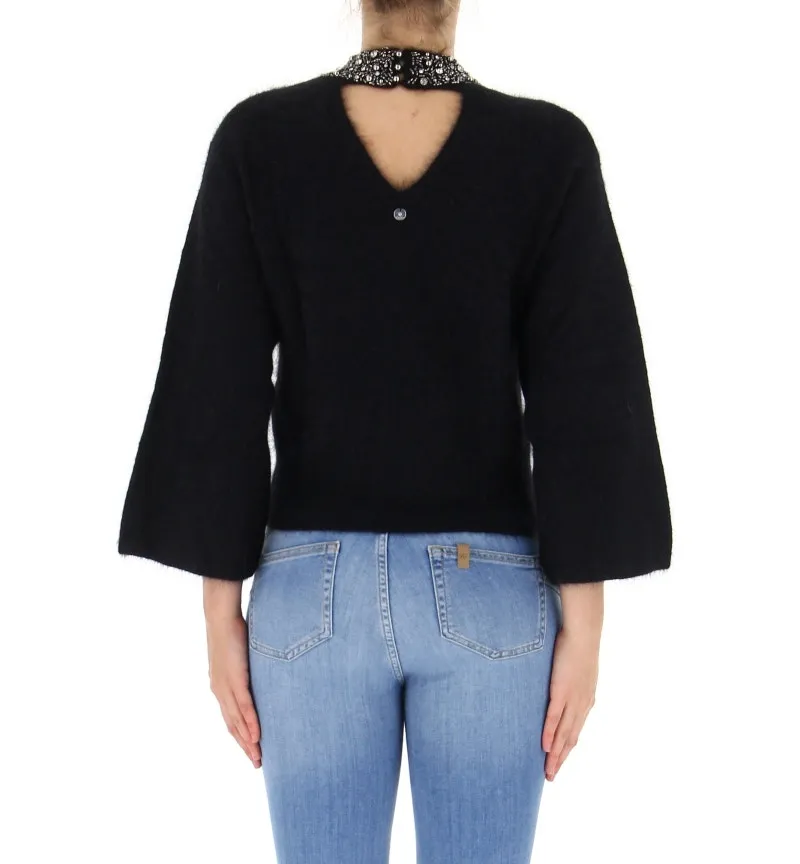 Maglione con applicazioni