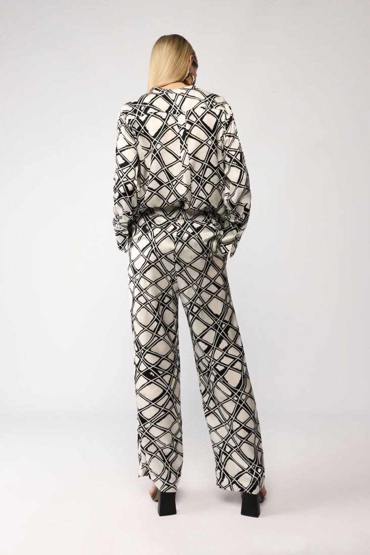 Pantaloni a palazzo fantasia astratta con tasche verticali