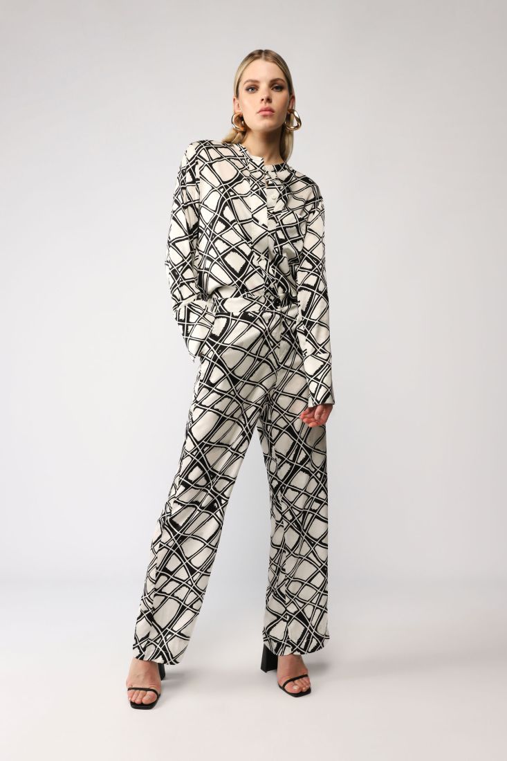 Pantaloni a palazzo fantasia astratta con tasche verticali