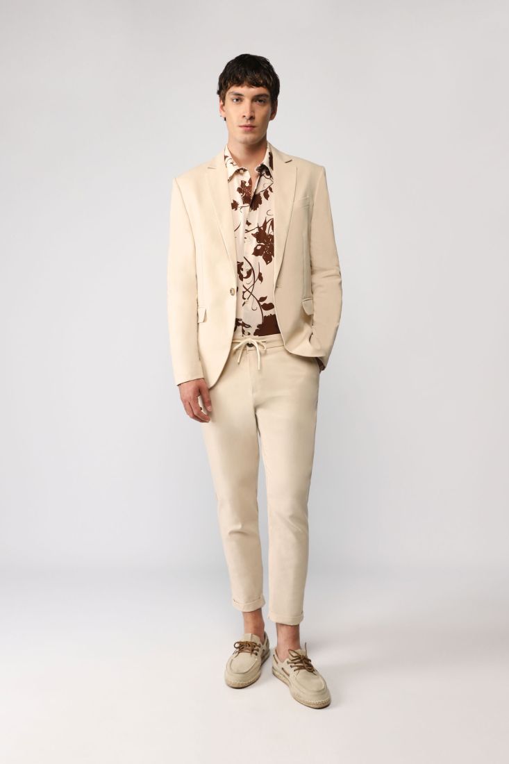 Pantaloni straight monocolour con coulisse e orli risvoltati